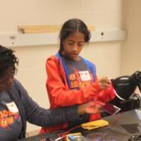 Students charging solar panels